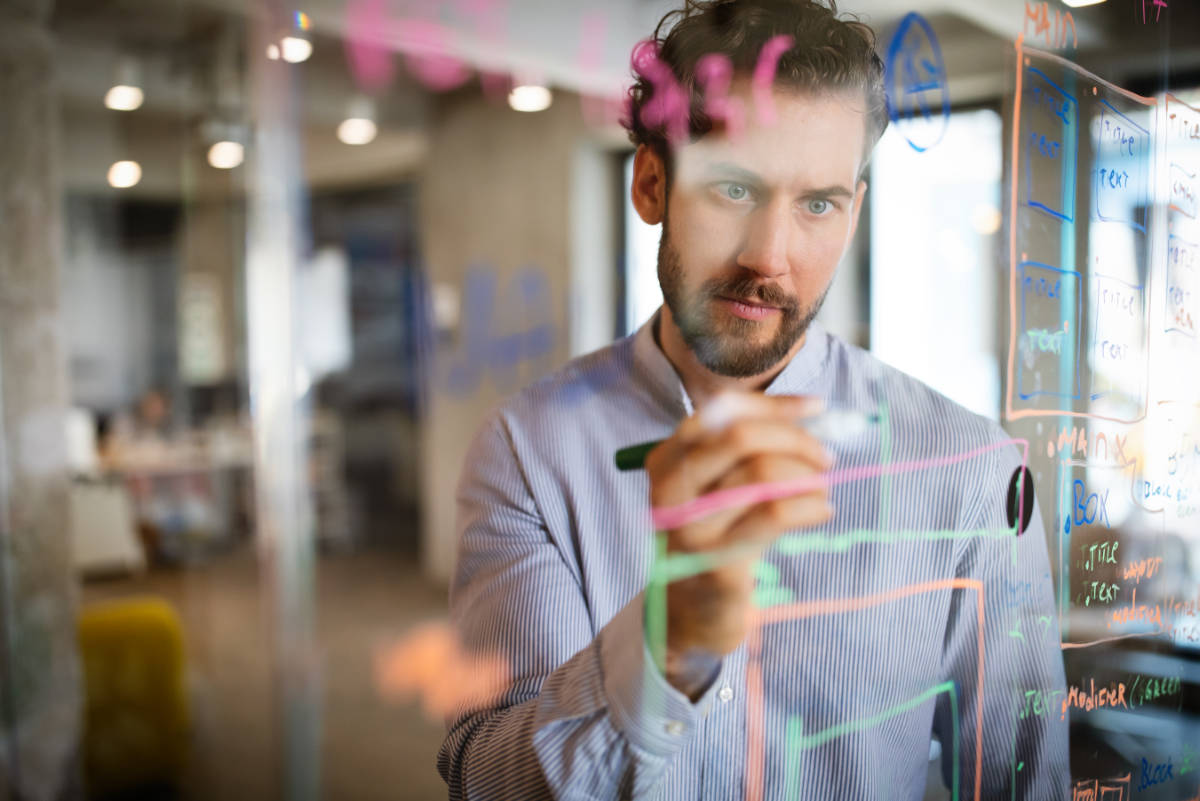 selective focus of cheerful call center operator in headset working in office